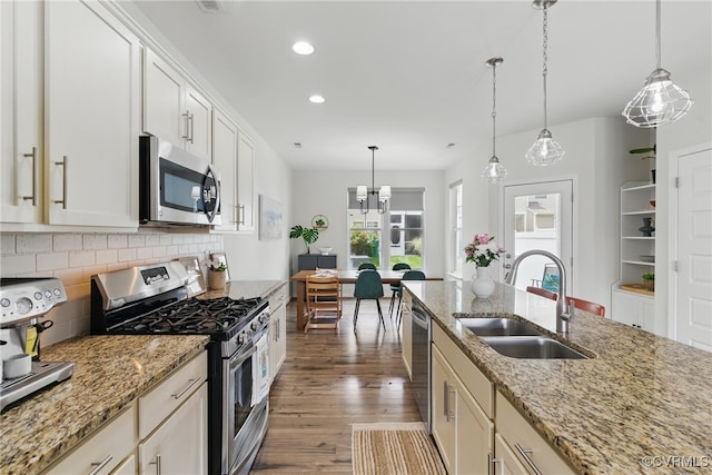 8045 Ellendale Dr, Mechanicsville, VA 23116 - kitchen with appliances with stainless steel finishes, tasteful backsplash, recessed lighting, dark wood-type flooring, and pendant lighting