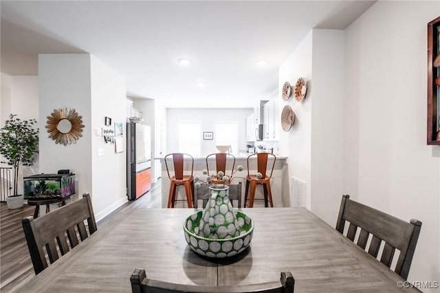 12325 Petrel Xing Unit 7, Midlothian, VA 23112 - dining room featuring wood finished floors and recessed lighting