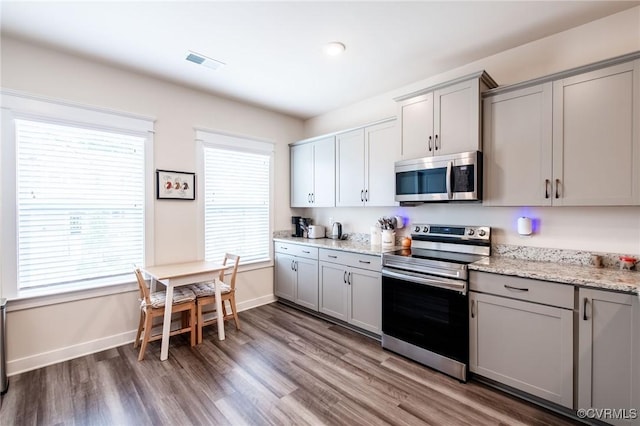 12325 Petrel Xing Unit 7, Midlothian, VA 23112 - kitchen featuring appliances with stainless steel finishes, gray cabinetry, and wood finished floors