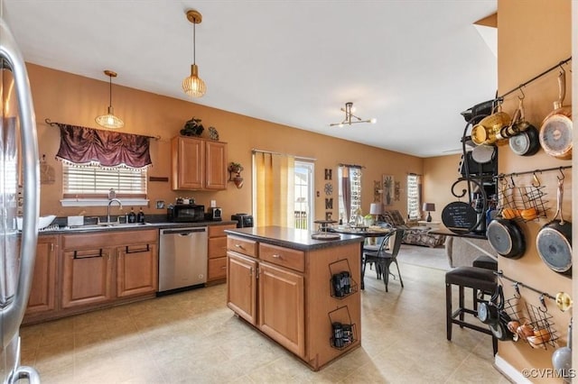 1408 Windrow Ct, Henrico, VA 23223 - kitchen with stainless steel appliances, dark countertops, a kitchen island, pendant lighting, and open floor plan