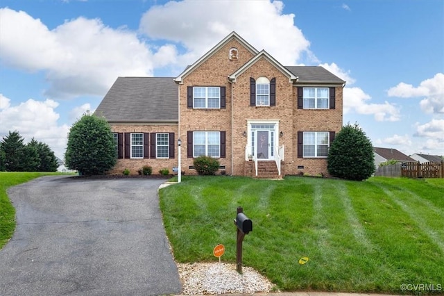 1408 Windrow Ct, Henrico, VA 23223 - colonial-style house featuring brick siding and asphalt driveway