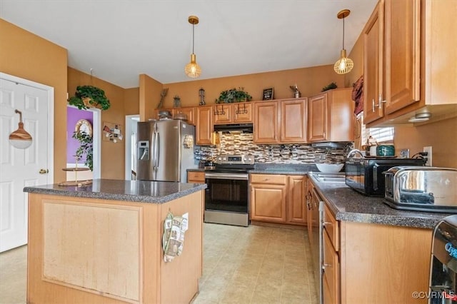 1408 Windrow Ct, Henrico, VA 23223 - kitchen featuring appliances with stainless steel finishes, under cabinet range hood, a center island, tasteful backsplash, and hanging light fixtures