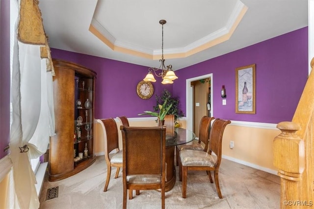 1408 Windrow Ct, Henrico, VA 23223 - dining space featuring light colored carpet, a raised ceiling, crown molding, and a chandelier