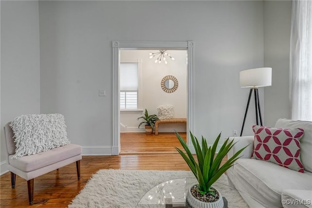 1111 N 23rd St, Richmond, VA 23223 - living area featuring wood-type flooring and a chandelier