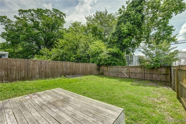 1111 N 23rd St, Richmond, VA 23223 - wooden deck with a fenced backyard