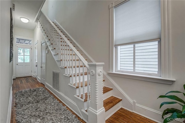 1111 N 23rd St, Richmond, VA 23223 - stairway with wood finished floors and baseboards