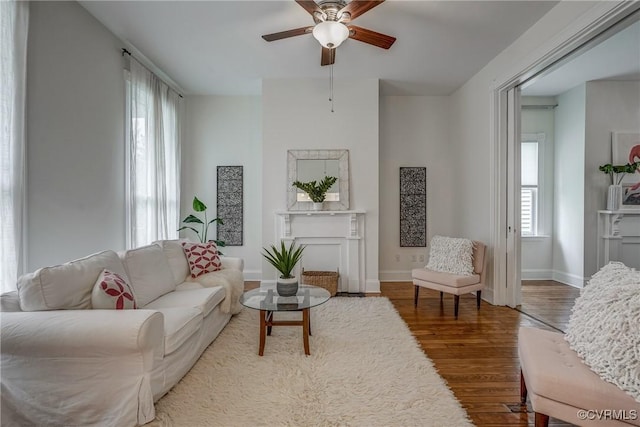 1111 N 23rd St, Richmond, VA 23223 - living area with a ceiling fan and wood finished floors