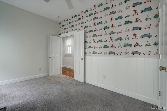 1111 N 23rd St, Richmond, VA 23223 - carpeted empty room featuring wainscoting, ceiling fan, and wallpapered walls