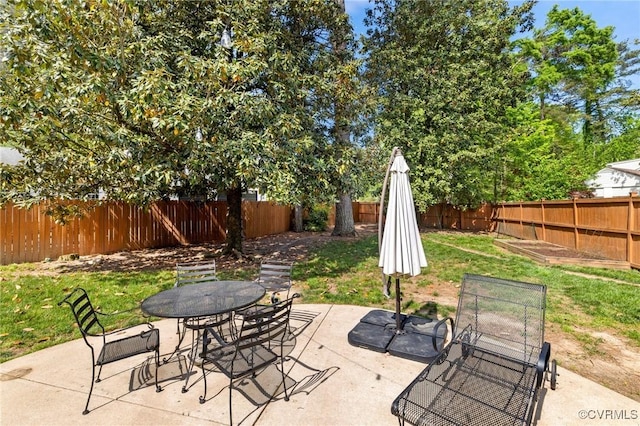 2740 Rettig Rd, Richmond, VA 23225 - fenced backyard featuring outdoor dining space and a patio