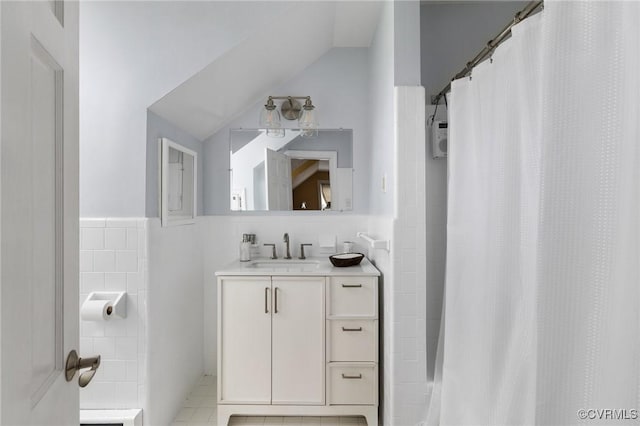 2740 Rettig Rd, Richmond, VA 23225 - full bathroom with tile walls, vanity, lofted ceiling, and curtained shower