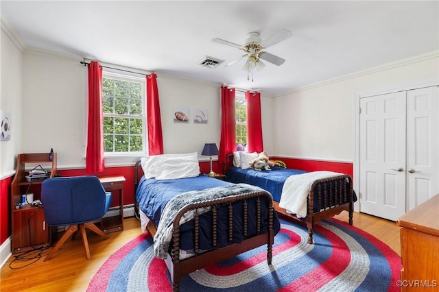2740 Rettig Rd, Richmond, VA 23225 - bedroom with wood finished floors, crown molding, a closet, an office area, and ceiling fan