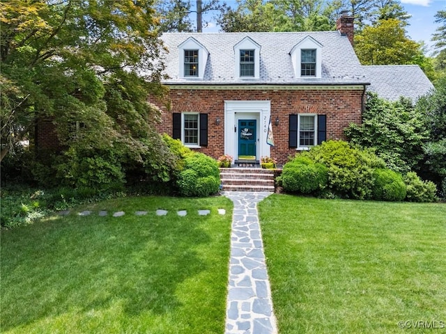 2740 Rettig Rd, Richmond, VA 23225 - cape cod-style house with a front yard, a chimney, and brick siding