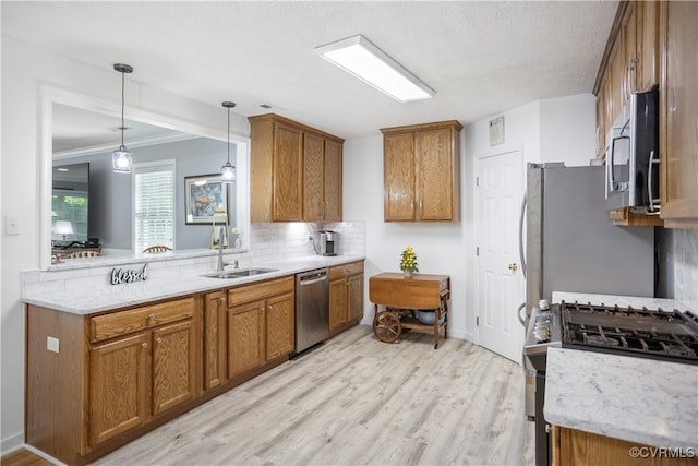 3826 Minitree Glen Dr, Providence Forge, VA 23140 - kitchen featuring stainless steel appliances, brown cabinets, tasteful backsplash, crown molding, and a textured ceiling