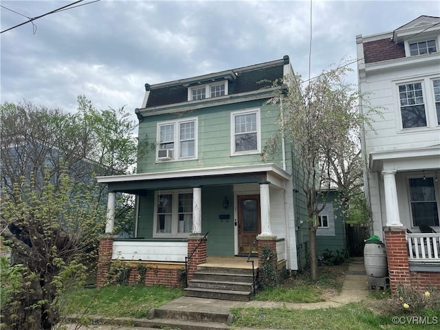 1527 National St, Richmond, VA 23231 - second empire-style home with a porch, cooling unit, and mansard roof