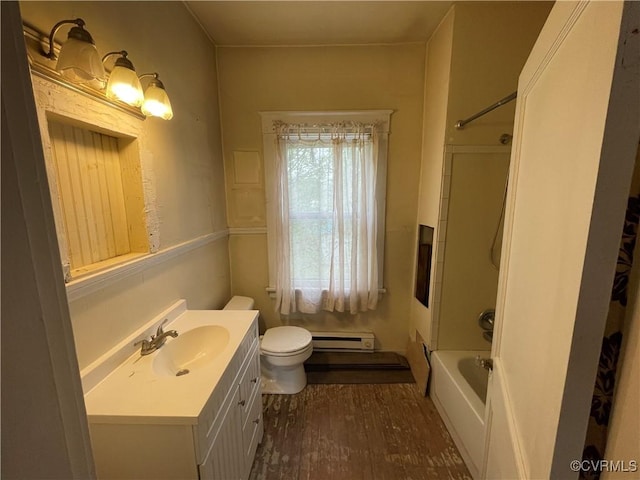 1527 National St, Richmond, VA 23231 - bathroom with vanity, baseboard heating, shower / washtub combination, and wood finished floors