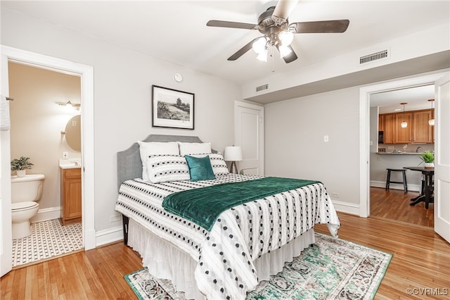 1112 Roseneath Rd Unit U1, Richmond, VA 23230 - bedroom featuring light wood-style flooring, ensuite bathroom, and a ceiling fan