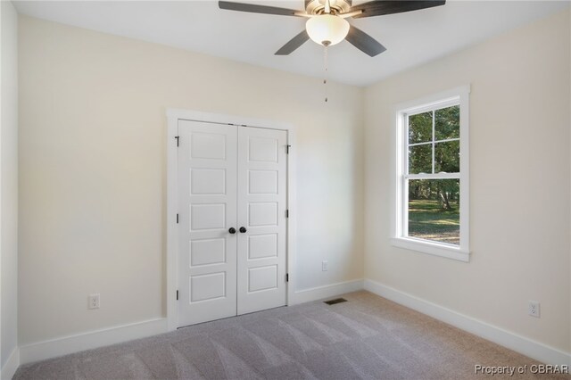 TBD Snows Cove Ln, Lottsburg, VA 22511 - unfurnished bedroom featuring carpet, a closet, and ceiling fan