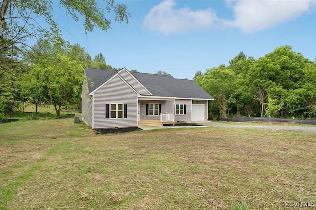 425 Palomino Dr, Louisa, VA 23093 - single story home with an attached garage, driveway, a front yard, and a porch