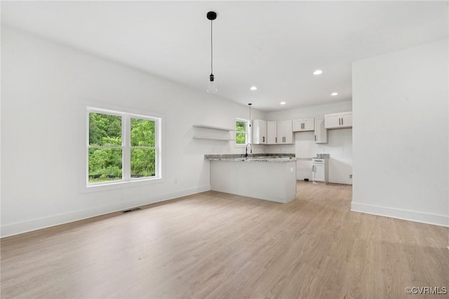 425 Palomino Dr, Louisa, VA 23093 - kitchen with a peninsula, white cabinetry, light wood-type flooring, recessed lighting, and open shelves