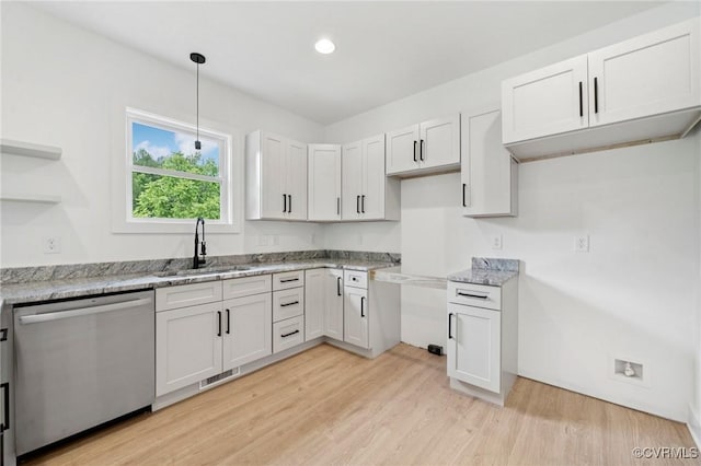425 Palomino Dr, Louisa, VA 23093 - kitchen with stainless steel dishwasher, light stone countertops, light wood-type flooring, open shelves, and hanging light fixtures
