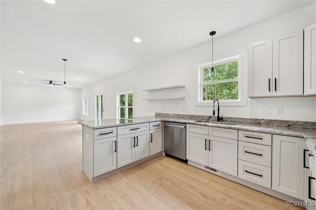 425 Palomino Dr, Louisa, VA 23093 - kitchen with dishwasher, a peninsula, light wood-style flooring, ceiling fan, and decorative light fixtures