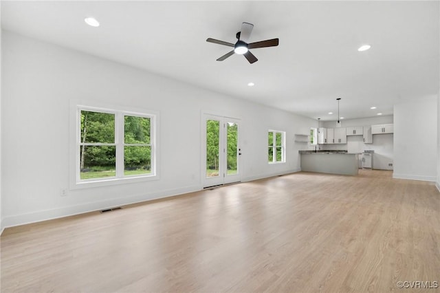 425 Palomino Dr, Louisa, VA 23093 - unfurnished living room featuring a ceiling fan, recessed lighting, and light wood-type flooring
