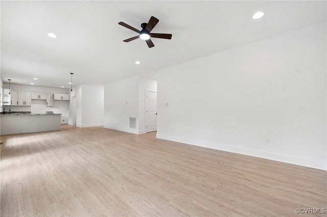 425 Palomino Dr, Louisa, VA 23093 - unfurnished living room with recessed lighting, a ceiling fan, and light wood-type flooring