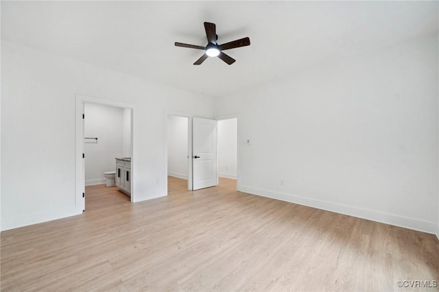 425 Palomino Dr, Louisa, VA 23093 - unfurnished bedroom featuring light wood-type flooring, connected bathroom, and a ceiling fan