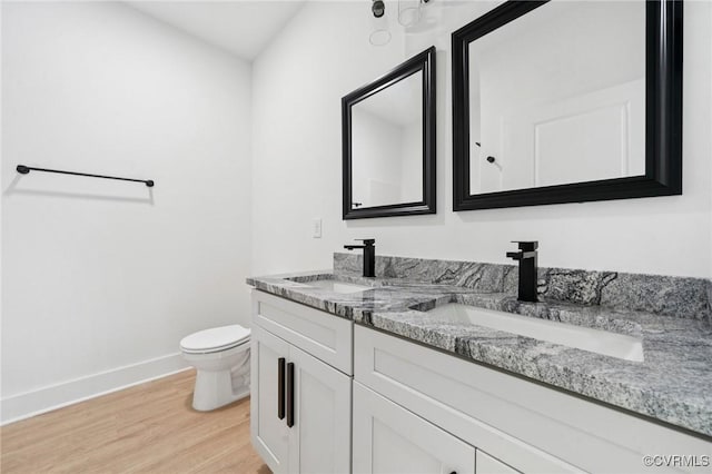 425 Palomino Dr, Louisa, VA 23093 - bathroom featuring double vanity and wood finished floors