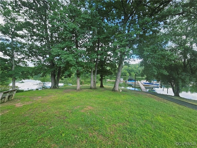 425 Palomino Dr, Louisa, VA 23093 - view of green lawn with a water view and a boat dock
