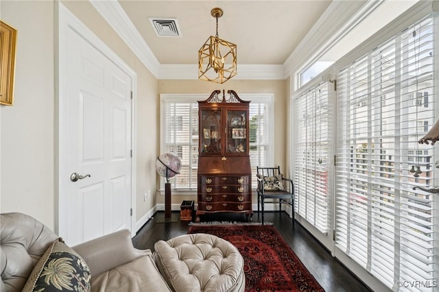 1231 Byrd Ave Unit 2C, Henrico, VA 23226 - living area with dark wood-style floors, crown molding, and a chandelier