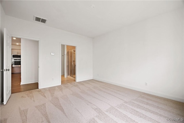 7204 Leire Ln, Moseley, VA 23832 - unfurnished bedroom featuring light colored carpet and a spacious closet