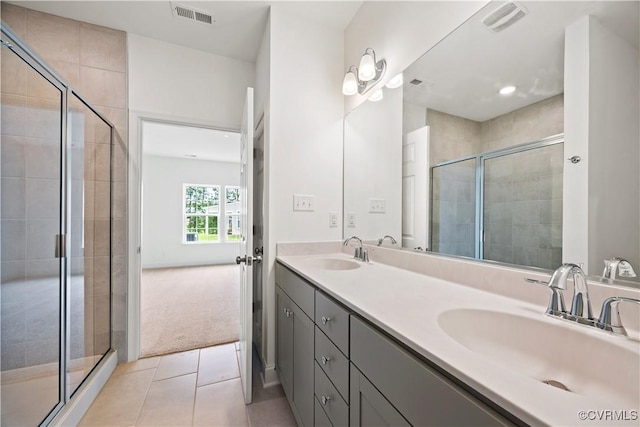 7204 Leire Ln, Moseley, VA 23832 - bathroom featuring double vanity, a stall shower, tile patterned floors, and recessed lighting