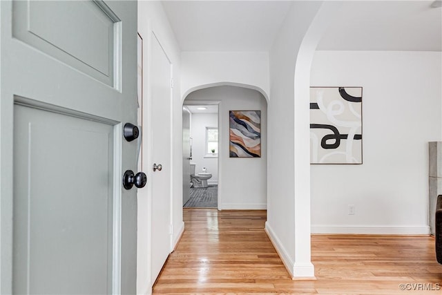 7654 Cherokee Rd, Richmond, VA 23225 - hall featuring light wood-type flooring and arched walkways