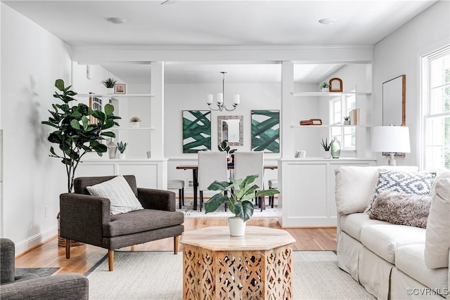7654 Cherokee Rd, Richmond, VA 23225 - living room with light wood-type flooring and a chandelier