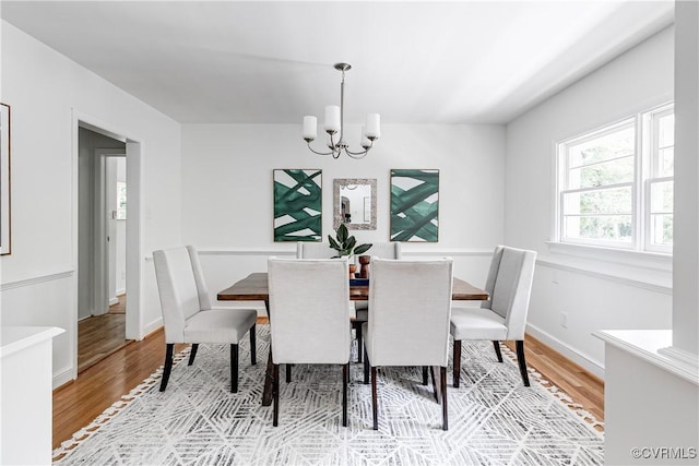 7654 Cherokee Rd, Richmond, VA 23225 - dining room with light wood-type flooring and a chandelier