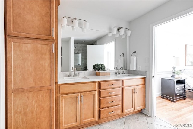 7654 Cherokee Rd, Richmond, VA 23225 - bathroom featuring double vanity, a shower with door, and tile patterned flooring