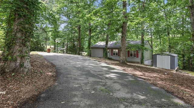 4804 Hackney Rd, Richmond, VA 23234 - ranch-style home featuring a storage unit and asphalt driveway