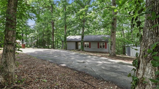 4804 Hackney Rd, Richmond, VA 23234 - view of front of house featuring asphalt driveway and a storage unit