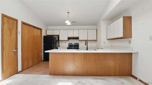 4804 Hackney Rd, Richmond, VA 23234 - kitchen with black appliances, a peninsula, white cabinets, under cabinet range hood, and light countertops