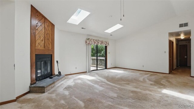 4804 Hackney Rd, Richmond, VA 23234 - unfurnished living room with vaulted ceiling, a skylight, light carpet, and a large fireplace
