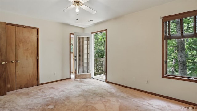 4804 Hackney Rd, Richmond, VA 23234 - unfurnished bedroom with access to exterior, multiple windows, carpet flooring, and ceiling fan