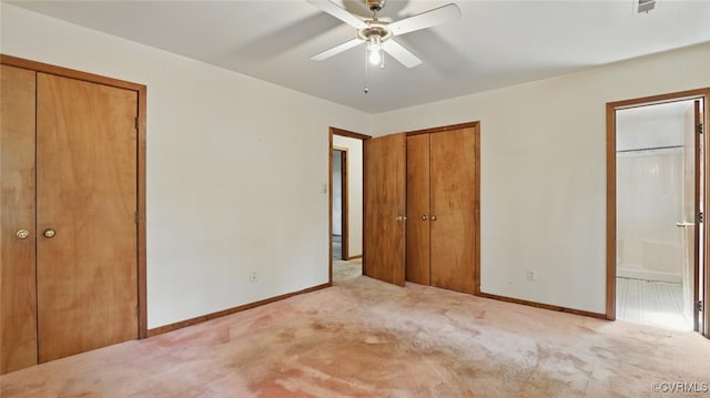 4804 Hackney Rd, Richmond, VA 23234 - unfurnished bedroom with two closets, carpet, connected bathroom, and a ceiling fan