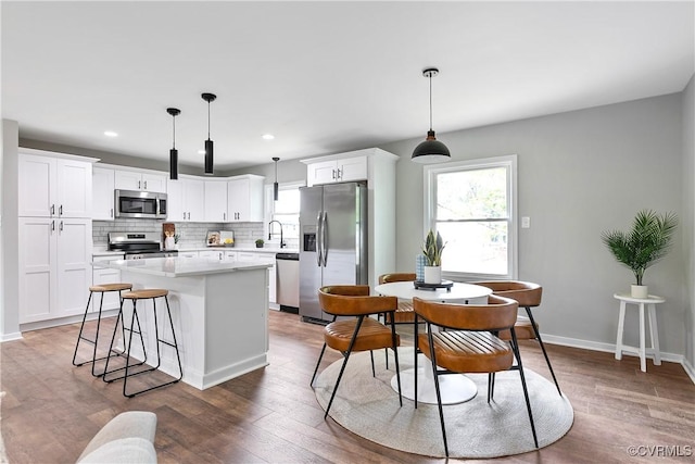 2914 Griffin Ave, Richmond, VA 23222 - kitchen featuring stainless steel appliances, a kitchen island, plenty of natural light, light countertops, and recessed lighting