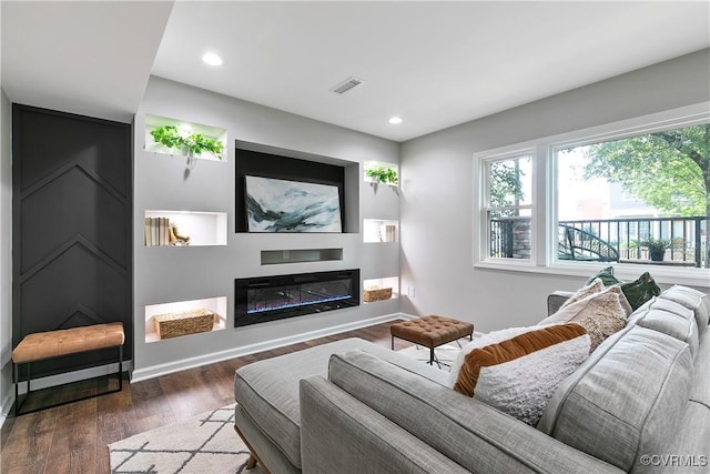 2914 Griffin Ave, Richmond, VA 23222 - living room featuring wood finished floors, recessed lighting, and a glass covered fireplace