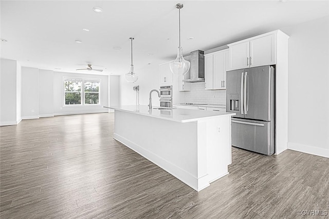 2642 Lassen Walk Unit B, Henrico, VA 23294 - kitchen with stainless steel appliances, wall chimney exhaust hood, ceiling fan, a center island with sink, and dark wood-type flooring