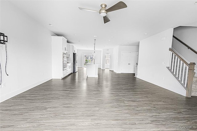 2642 Lassen Walk Unit B, Henrico, VA 23294 - unfurnished living room with ceiling fan, dark wood-type flooring, and stairs