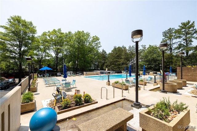 2956 Hathaway Rd Unit U606, Richmond, VA 23225 - community pool with a patio area and view of wooded area