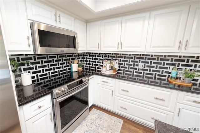 2956 Hathaway Rd Unit U606, Richmond, VA 23225 - kitchen with appliances with stainless steel finishes, white cabinetry, backsplash, dark stone countertops, and wood finished floors