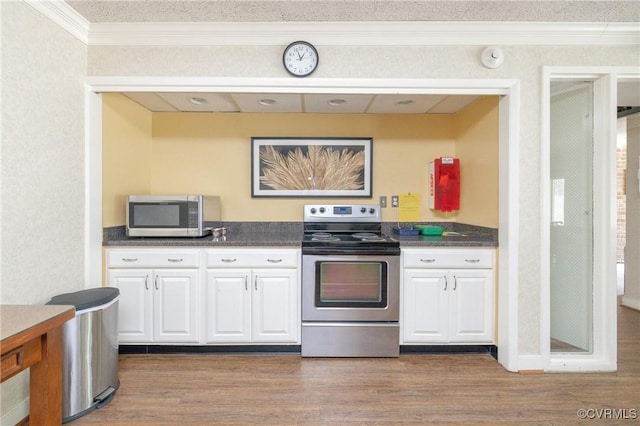 2956 Hathaway Rd Unit U606, Richmond, VA 23225 - kitchen with appliances with stainless steel finishes, crown molding, dark countertops, white cabinetry, and dark wood-type flooring